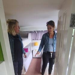 Katie & Jessica in their room. Notice low ceilings. They kind of tapered, as dis the floor.