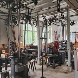 The old machine shop used overhead rotating pipes with bands connected to machines.
