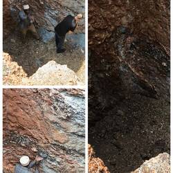 Saphir Mine. In dem schwarzen, bröseligen Material sind Saphire. Problem ist daranzukommen.