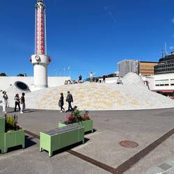 Tom with arms outstretched on the roof of the Amos Rex art museum