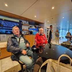 Frank and Ted settling in the lounge just fine now that they have their wine