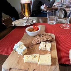 Topped offer supper with 3 farm cheeses, cloudberry jam, and a glass of cloudberry cordial.