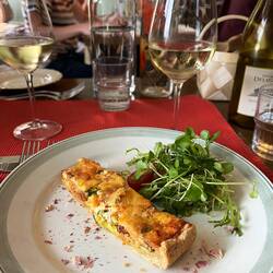 Warm smoked salmon and asparagus pie with oat crust, herb and tomato salad.