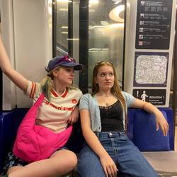 Lily and leg on the metro. Posing? Never heard of it