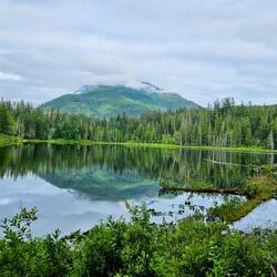 Reflection of mountains in the clouds in Antler Lake