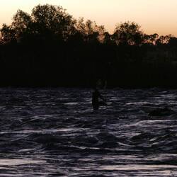 There is a man with fishing nets out there!