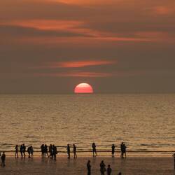 Compare the number of people on the beach....