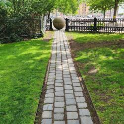 This memorial symbolizes the railroad track.  It leads to the current synagogue.