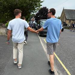 Chris and his brother Ben; Ben got a laugh out of holding Chris' hand and Chels snapped a pic 😂