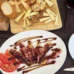 Leeks wrapped in bacon and a cheese platter.