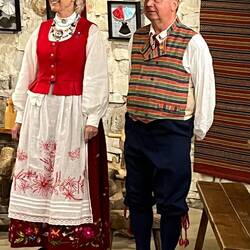 Married women wear hats/white stockings; unmarried-- ribbos/white stockings