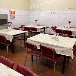 Dining room of the Soviet bunker, complete with oilcloth and plastic flowers