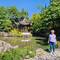 Me in front of the pond and pergola