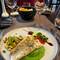 Pan fried perch on a bed of puréed peas with a salsa of mango and pistachios