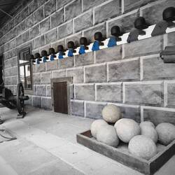 Cannon balls on the wall and the larger balls on the ground are for the trebuchet