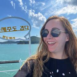 We don't know what the caption says, but probably "I love Jeju" or some similar lie.