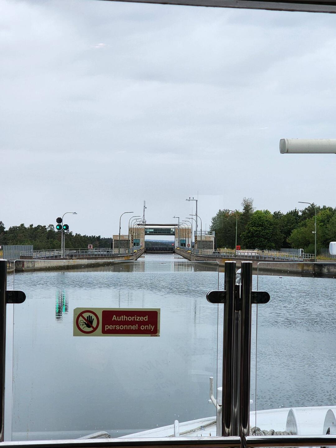 Heading into a lock where the ship will descend in water level by 25 metres