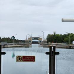 Heading into a lock where the ship will descend in water level by 25 metres