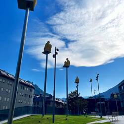 6 of the 7 poets, the 7th is lower and behind the trees in the background