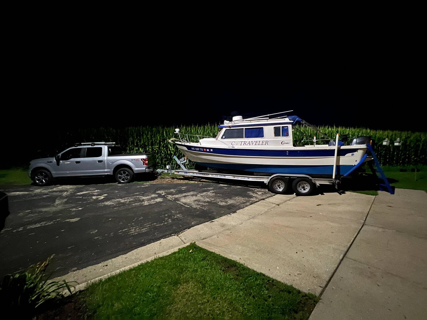 Hitched up and loaded up, ready to go. The corn is as high as the boat. 9.5'!