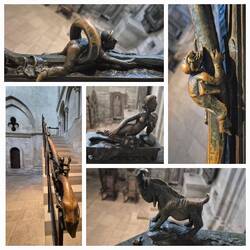 Handlauf mit Bronzefiguren auf dem schmalen Weg zum Paradies