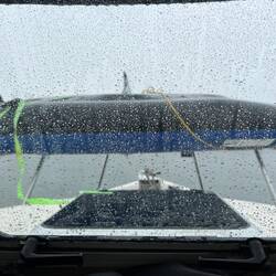 Rosanne's kayak upside down on our bow to keep it dry looks like a shark back. lol