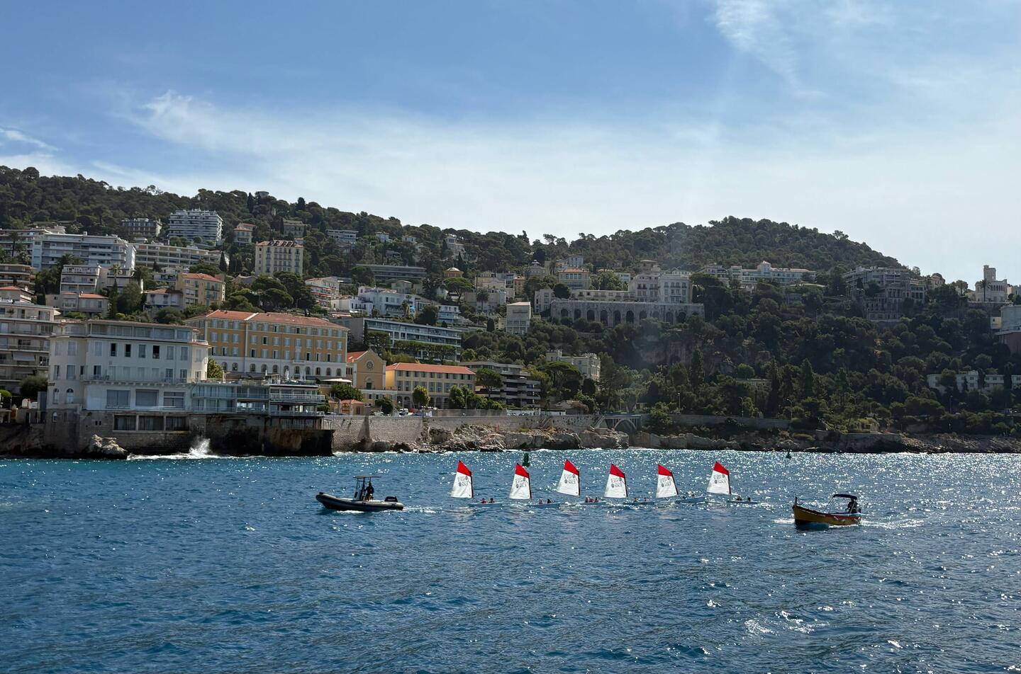 Kids learning to sail being towed along, very cute