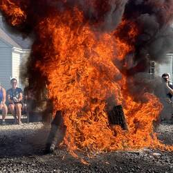 The kerosene flares the fire which causes the boil over, taking all the fish oils with it.