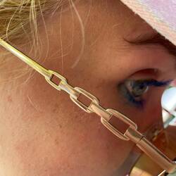 Lily's eyebrow has a mustache swirl