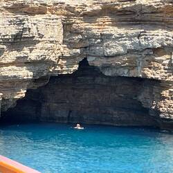 Jess swims to the cave