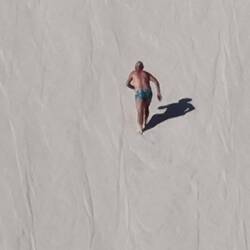 Derek climbing the sand dune