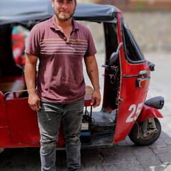 Pedro, a tuk-tuk driver in Flores.