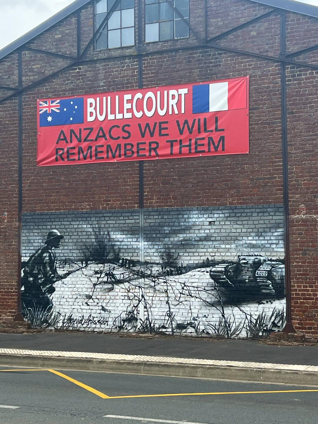 The wall of a building in the Main Street of Bullecourt