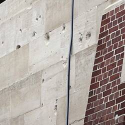 In WW2 it was used and suffered significant damage they left a few of the bullet holes as a memorial