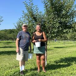 Me and Rosanne next to a cherry tree.