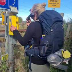Phoning for permission to cross the railway at Belford Burn