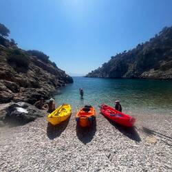 Three kayaks on the beach