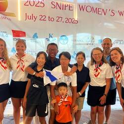 SSA sailors presenting burgee to Regatta Chair/PRO Shinichi Uchida and family