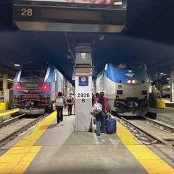 Our train is on the right, with double-headed locomotives ready to push out of the station