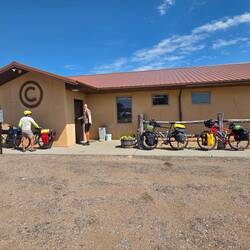 Town market run by HS students. Building was built with bales of straw.