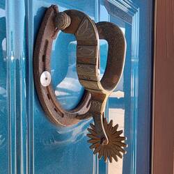 Door knocker complete with spur