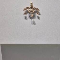 The Malia Bee Pendant: a Minoan gold masterpiece symbolizing bees, honey, and fertility.