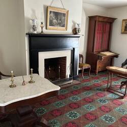 The sitting room of the McLean house where the surrender was signed; Grant to the right, Lee at left