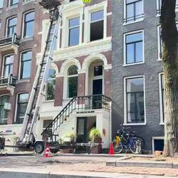 Furniture lift. Most moving is done via window as the stairs are too narrow.