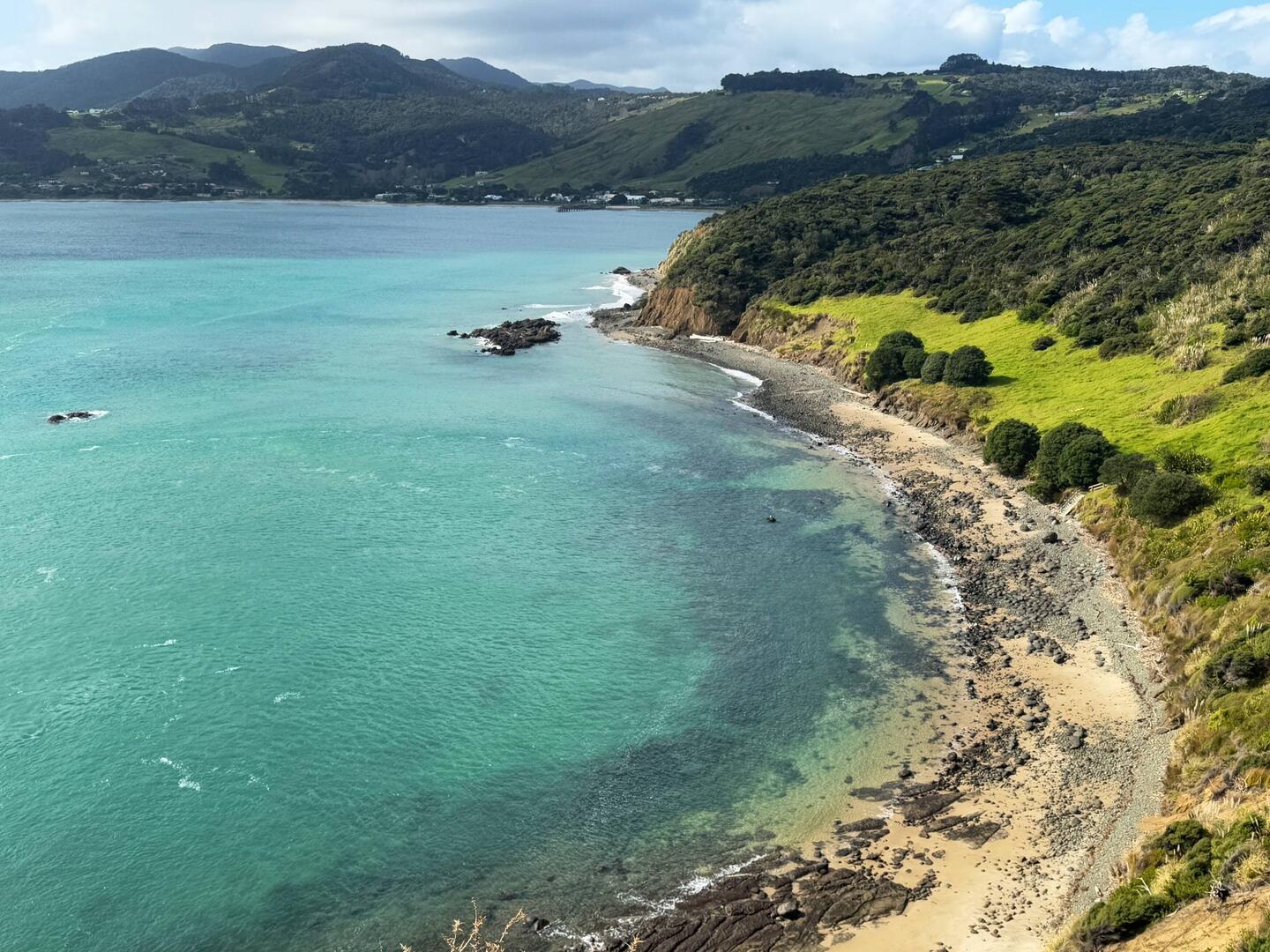 Turquoise seas seen from the headland walk we did in Arai te Uru Nature Reserve