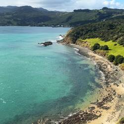 Turquoise seas seen from the headland walk we did in Arai te Uru Nature Reserve