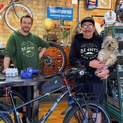 Benny (right) with Aroha, the resident pooch and mechanic, Dom, originally from N.Ireland