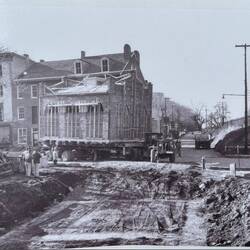 A historic photo - the building's 5th move. Note the memorial up on the railroad embankment