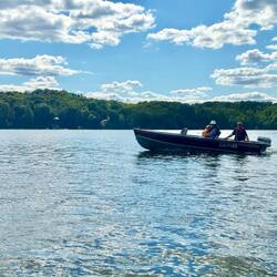 Melissa, Rob and Johnny going past on their boating adventure