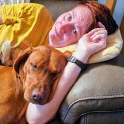 Vicky's parents' dog Elsie trying to make up for the doggie snuggles Vicky is missing from T & L